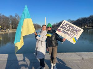 Marta holding the Ukrainian flag at the National Mall. 