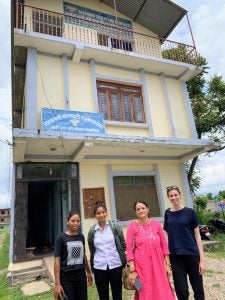 Therese and coworkers in front of the BASE office.